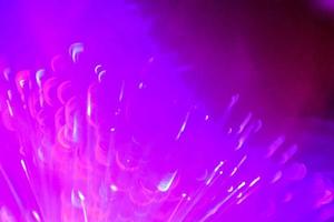 light purple neon light abstract Neon bright lens flare colored on black background.dark abstract futuristic background and Neon