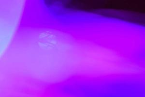 light purple neon light abstract Neon bright lens flare colored on black background.dark abstract futuristic background and Neon photo