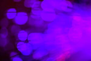 light purple neon light abstract Neon bright lens flare colored on black background.dark abstract futuristic background and Neon photo