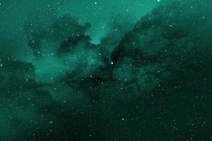 Fondo abstracto de textura de color espacial azul verdoso, color espacial en galaxia en negro foto