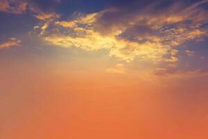 sunset and orange cloud and blue dawn sky with cloud horizontal lines motion effect on background from sunshine. photo