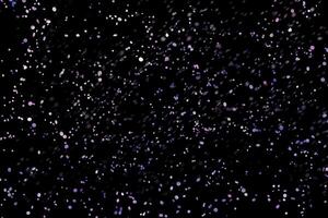 dark purple sparkle Abstract stylish light effect on a black background and sparkles Sparkling magical dust particles on black photo