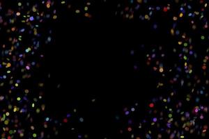 Efecto de luz con estilo abstracto de brillo colorido sobre un fondo negro y destellos de partículas de polvo mágicas brillantes sobre negro foto