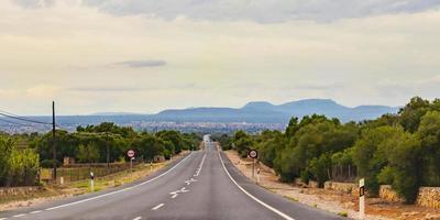 Driving between buildings in the town Campos on Mallorca Spain photo