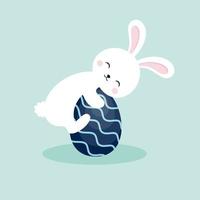 lindo conejito abraza un huevo de pascua. personaje de vector para niños en estilo de dibujos animados. Ilustración para las vacaciones de Pascua. dibujo de una postal.