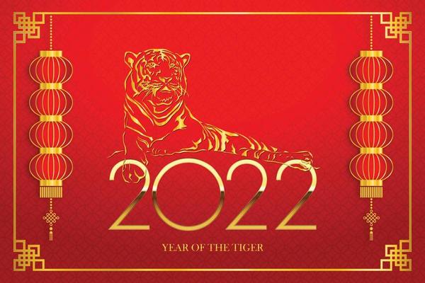 Golden tiger symbol on golden chinese pattern background Happy Chinese New Year 2022 Everything is going very smoothly and small Chinese wording translation Chinese calendar for the tiger of 2022