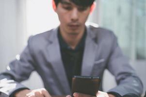 Businessman using smart phone to work, communicate. photo