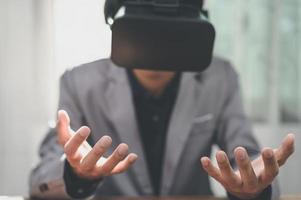 Entrepreneurs are using virtual reality glasses in the online world, virtual metaverse. photo