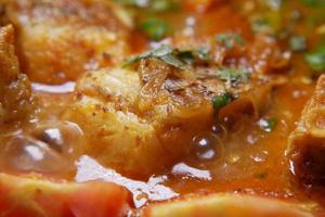 Close up of homemade indian curry fish photo