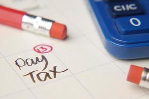 tax day concept with red circle on calendar date photo