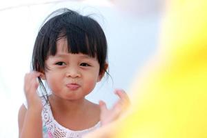 Portrait of a cute Asian girl smiling happily photo