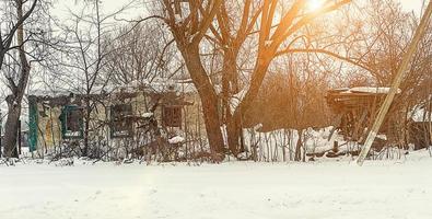 old disorganized house in the winter photo