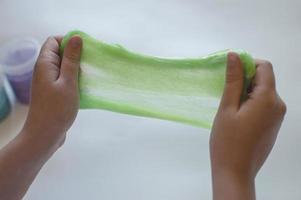 slimes in the hand of a child photo