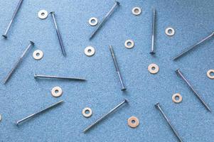 Repair. Screws and washers on the desktop. The concept of a repair shop. photo