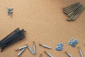 Repair. Screws and washers on the desktop. The concept of a repair shop. photo