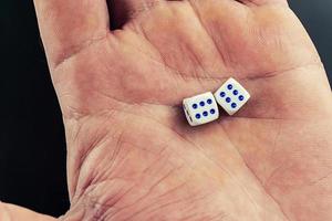 dice in a man's hand photo