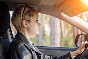 beautiful girl driving a car photo