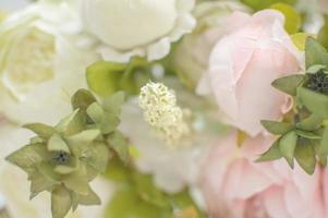 texture artificial roses on the wedding arch. decoration. background. selective focus photo