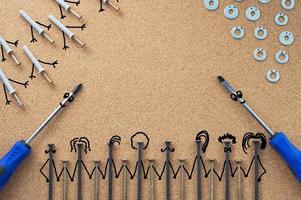 Repair. Self-tapping screws, washers, and screwdrivers with bitmap elements on the desktop. The concept of a repair shop photo