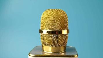 Gold microphone rotate on table video