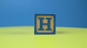 Close up shot letter H alphabet wooden block video