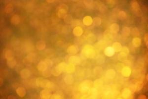 Defocus light yellow glitter. Color is gold abstract background. photo