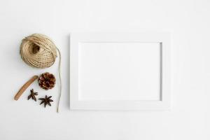 white wall and dark tree decoration Modern frames desk home decoration with frame photo and mock up white frame and dry twigs in vase on book shelf or desk