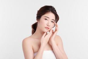 Beautiful young asian woman with clean fresh skin on white background, Face care, Facial treatment, Cosmetology, beauty and spa, Asian women portrait. photo