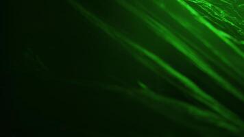 Plastic texture with a green neon light photo