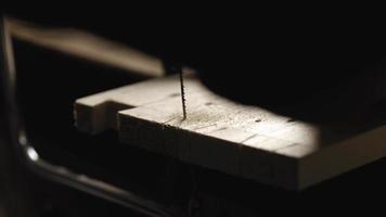 Carpenter cuts out a dovetail on a pine board video