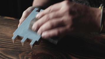 Carpenter grinds a painted wood part video