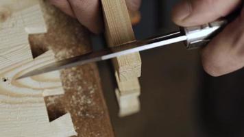 Artisan cuts out a dovetail video