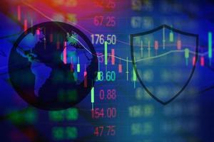 Data security systems computer with shield and global communication secure data network on stock graph charts for protect crime by an anonymous hacker internet technology background cyber security photo
