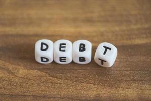Debt management plan on a table - cut debt concept
