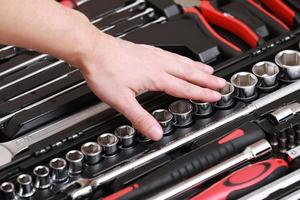 Customers or worker, builder, repairman, handyman, at the store chooses wrench, nuts, instrument, tools. Display of tools shop marketing for home and auto repair photo