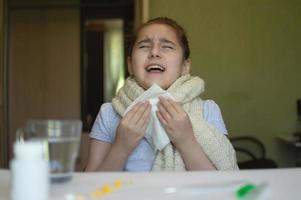 little girl with fever and sneezes photo