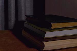 books on the table in the night light