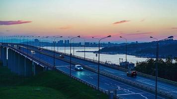 Timelapse of the city landscape with a view of the Russian bridge. photo