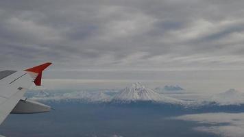 Flight by plane over the volcanoes of Kamchatka photo