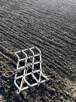 Plowed field for potato in brown soil on open countryside nature photo