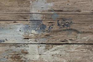 old rough horizontal wooden pattern with traces of paint photo