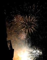 Burst colorful fireworks in night dark sky photo