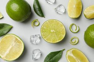 Flat lay with ripe lime on light gray background photo