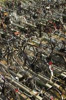ROTTERDAM, NETHERLANDS, 2021 - Numerous parked bicycles in Rotterdam, Netherlands.  160.000 - 25 percent of Rotterdam inhabitants using their bikes daily. photo