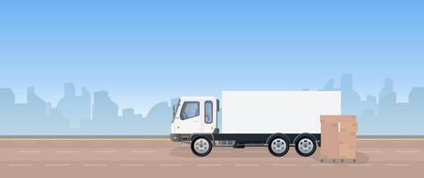 A white truck is driving down the road with boxes on it vector