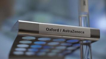 Coronavirus Oxford AstraZeneca Vaccine Test Tubes Being Placed Into Rack. Locked Off, Low Angle, Close Up video