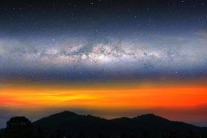 Milky way night landscape sunset light on silhouette mountain photo