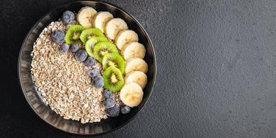 oatmeal berries oat flakes breakfast porridge vegan or vegetarian food photo