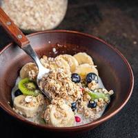 oatmeal berries oat flakes breakfast porridge vegan or vegetarian food