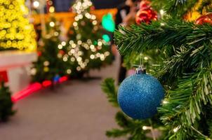 Blue balls decorated with Christmas tree decorations. New year and Christmas festivals. Copy space background.